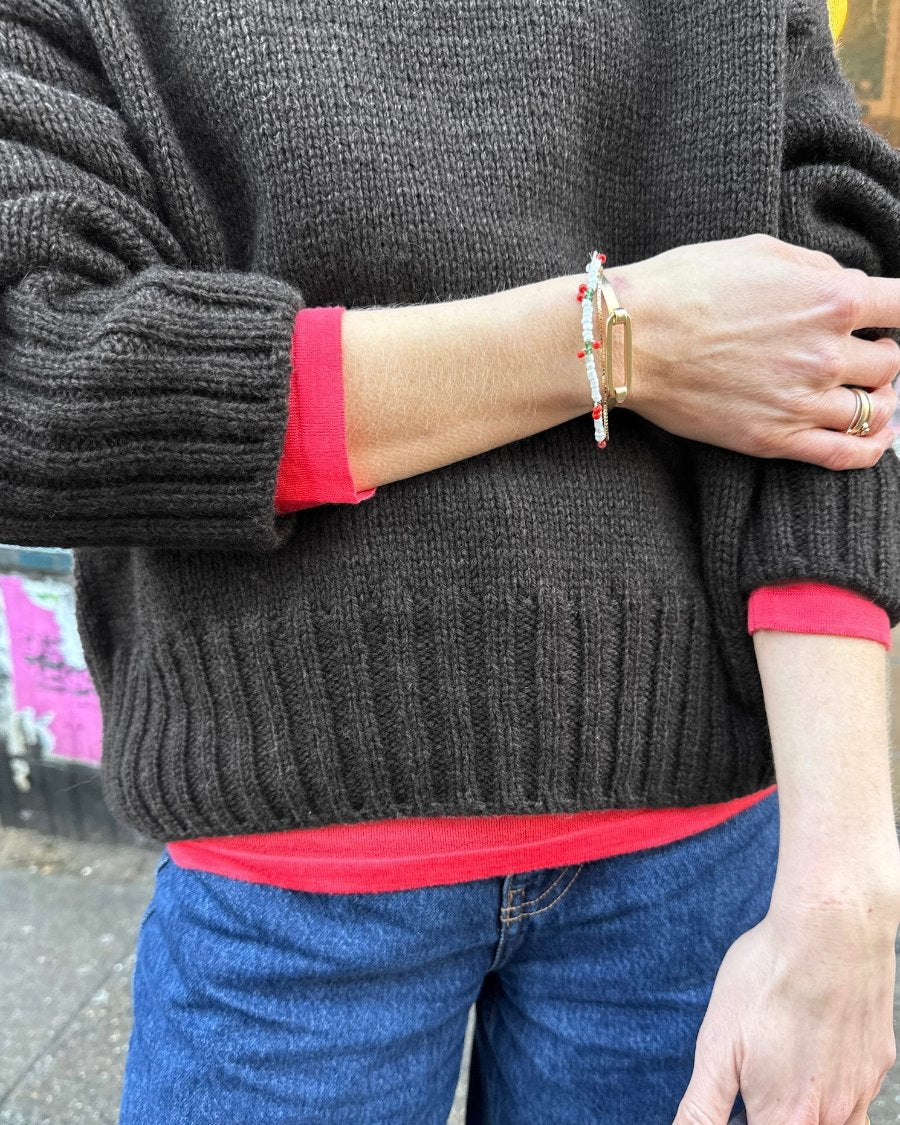 Knitted sweater showing how to adapt knitting patterns with different yarns and fibres