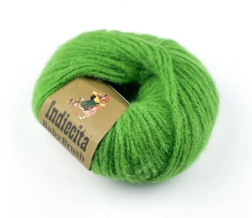 Green skein of alpaca yarn with a label on a white background