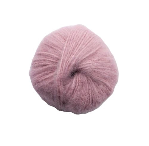 Pink yarn ball on a white background
