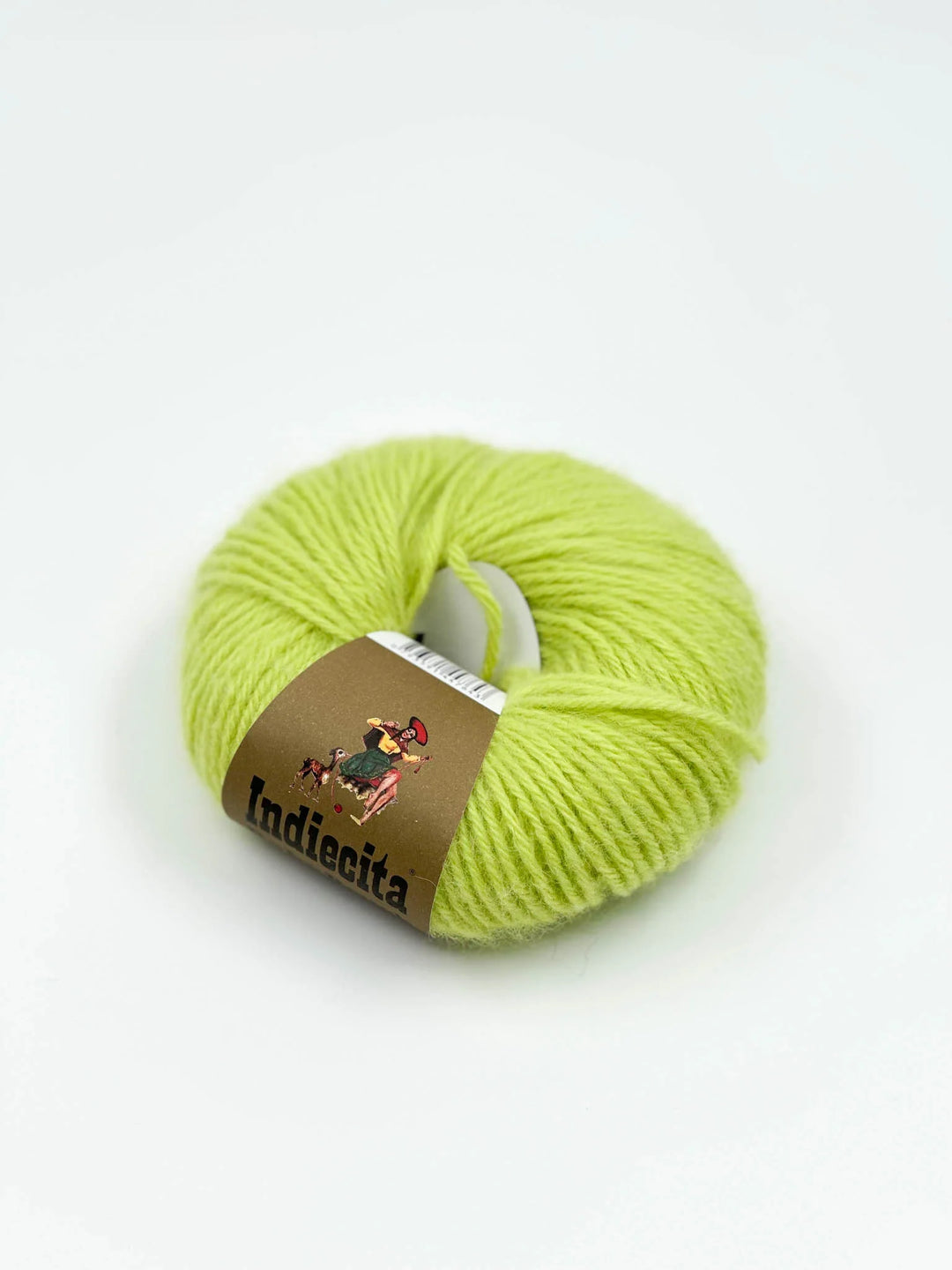 Ball of green alpaca yarn with a label on a white background