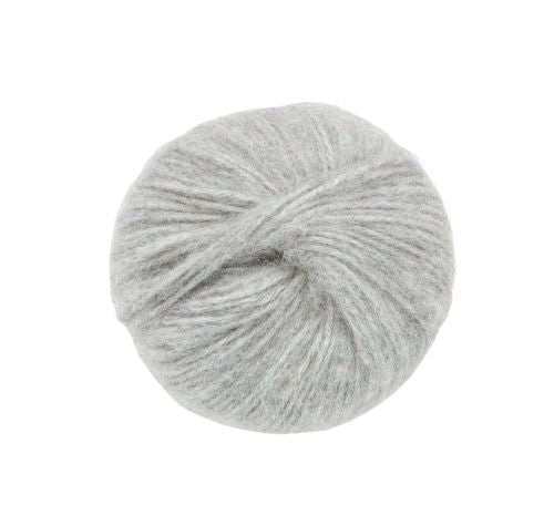 Gray skein of alpaca yarn on a white background