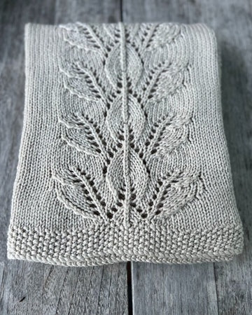 The Kiwi Knit and Stitch Co Autumn Leaves Baby Blanket.