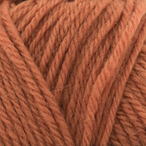 Close-up of a ball of orange-brown yarn