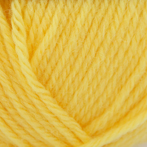 Close-up of a ball of yellow Broadway Purely Wool DK 8 Ply yarn
