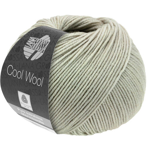 Ball of light gray yarn with a label on a white background