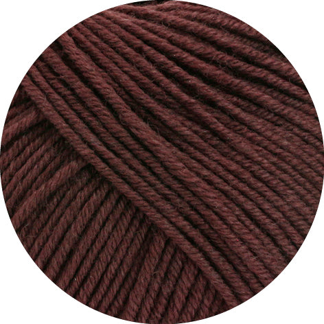 Close-up of brown yarn on a white background