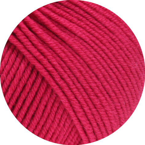 Close-up of bright pink yarn on a white background