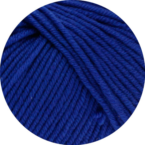 Close-up of a ball of blue yarn on a white background