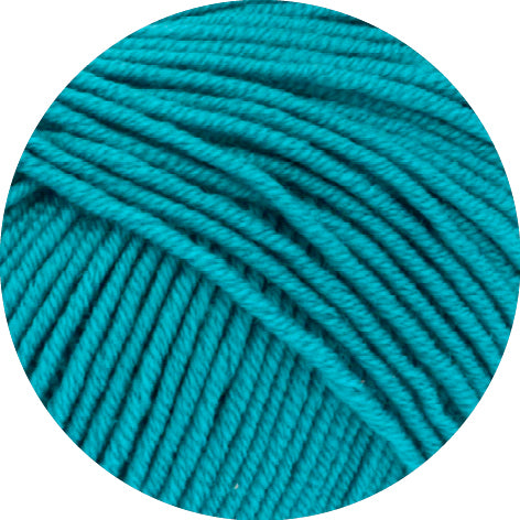 Close-up of teal yarn on a white background