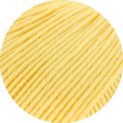Close-up of yellow yarn on a white background
