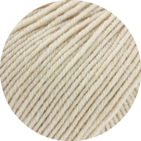 Close-up of beige yarn on a white background