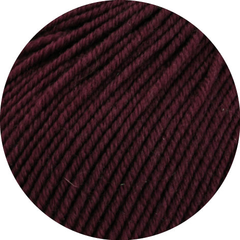 Close-up of dark purple yarn on a white background