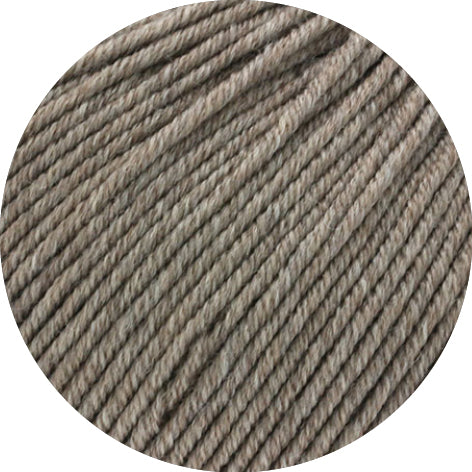 Close-up of grey brown yarn on a white background