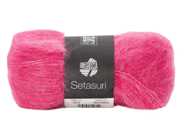Skein of pink yarn with a label on a white background