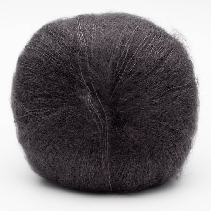 Ball of dark gray Silky Kid yarn in the shade anthracite on a white background