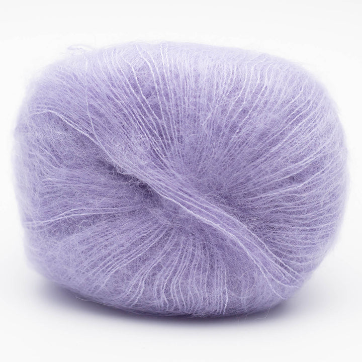 Ball of lilac Silky Kid yarn on a white background