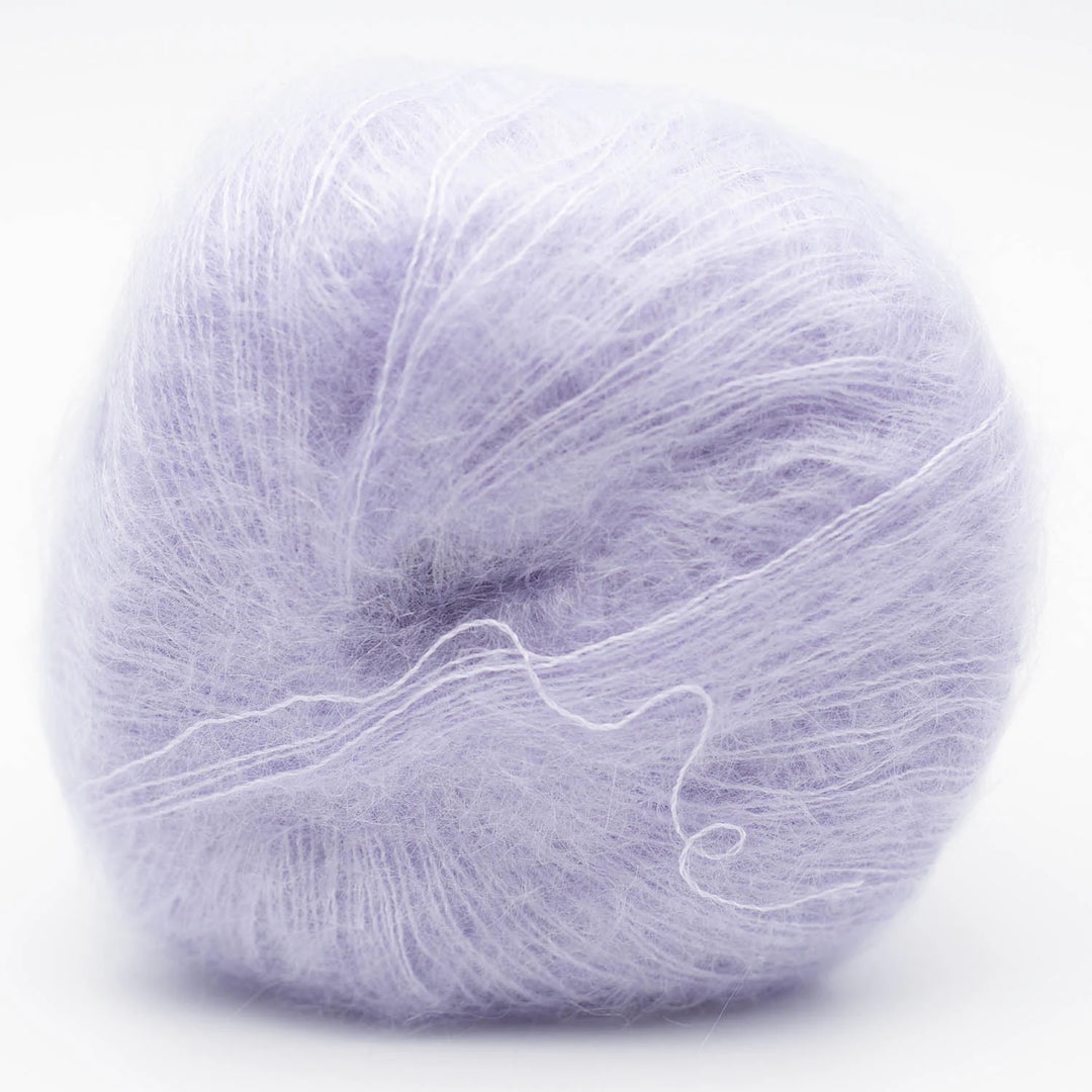 Ball of light purple Silky Kid yarn in shade pale lilac blue on a white background