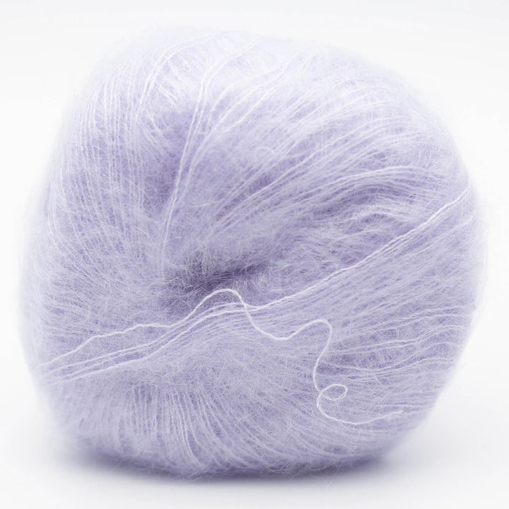 Ball of light purple Silky Kid yarn in shade pale lilac blue on a white background