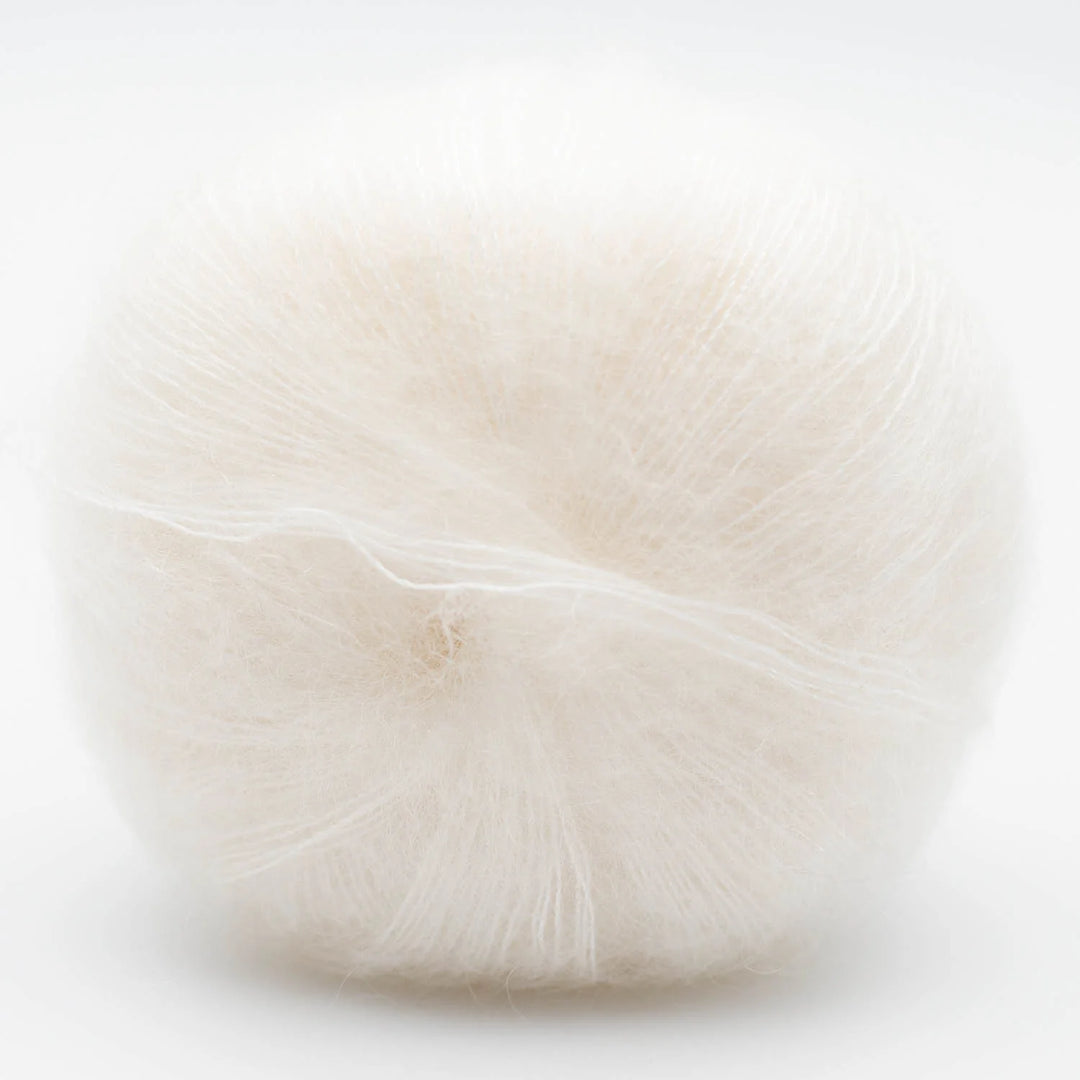 White wool Silky Kid yarn on a light background