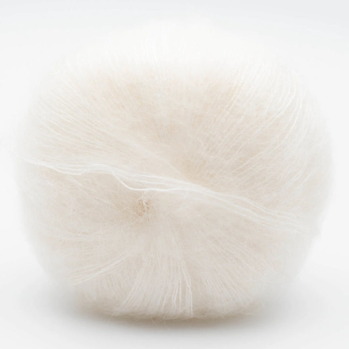 White wool Silky Kid yarn on a light background