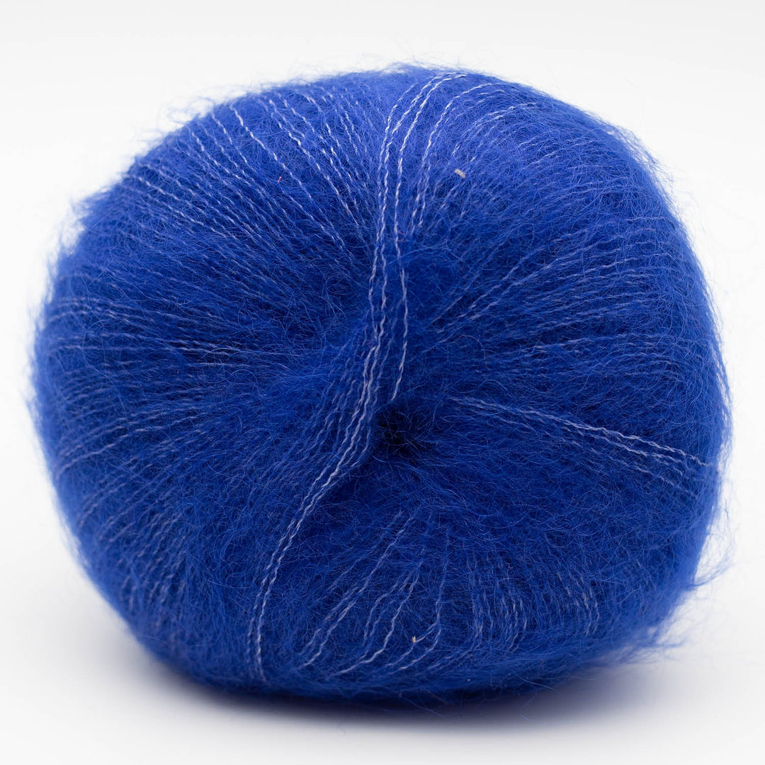 Blue Silky Kid yarn ball on a white background
