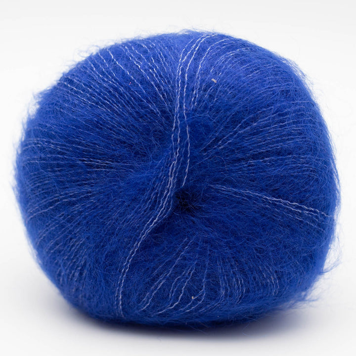 Blue Silky Kid yarn ball on a white background