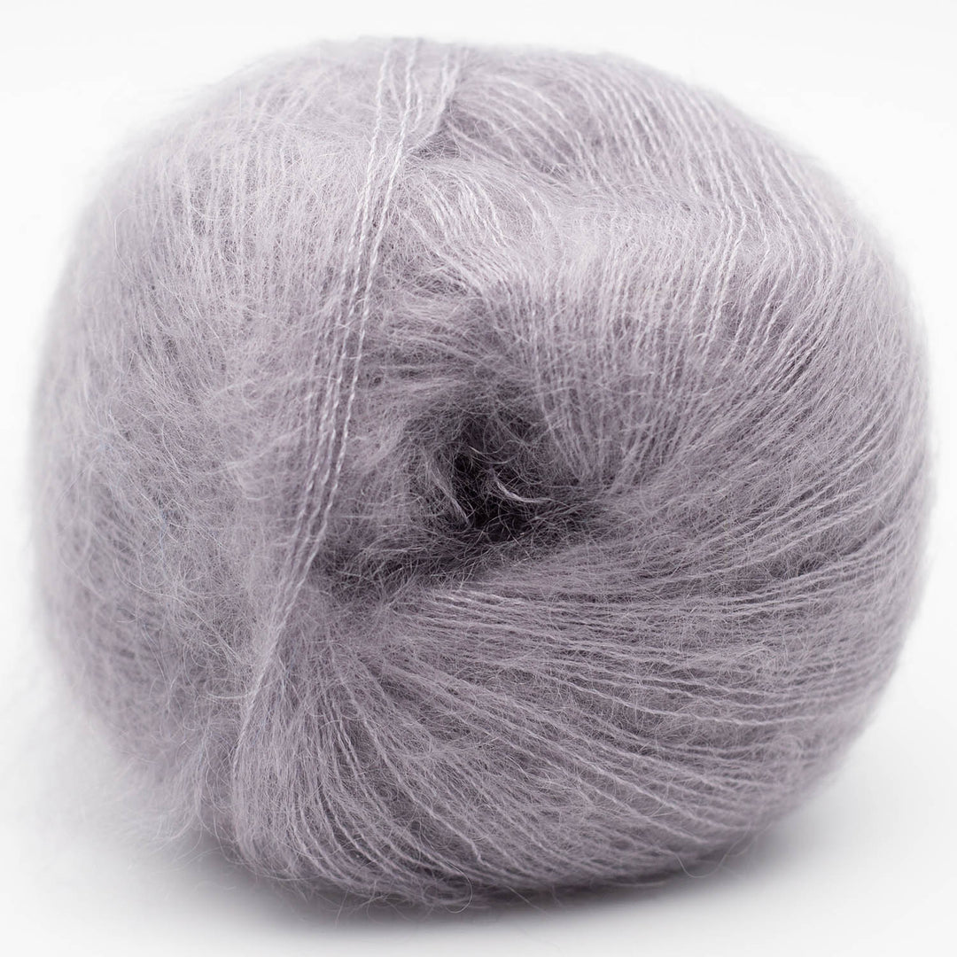 Gray skein of Silky Kid yarn on a white background