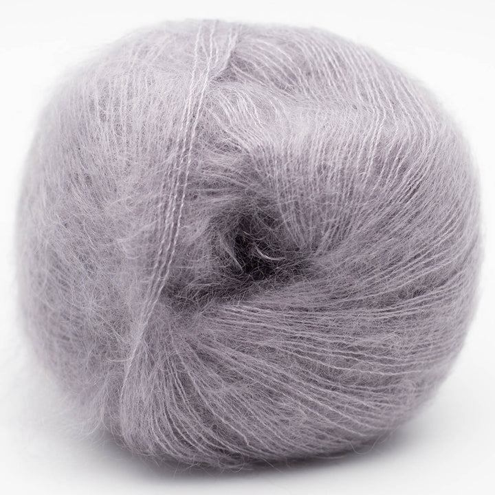 Gray skein of Silky Kid yarn on a white background