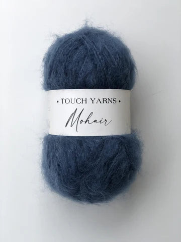 Blue yarn ball with 'Touch Yarns Mohair' label on a white background