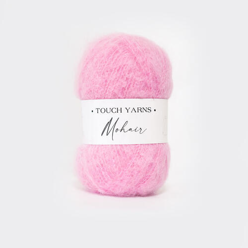 Pink skein of yarn ball with a label on a white background