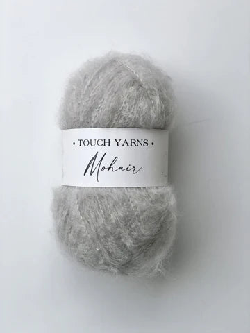 Gray mohair yarn with a Touch Yarns label on a white background