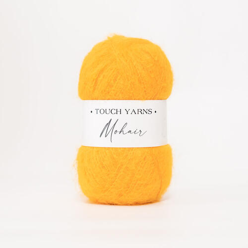 Yellow ball of yarn with a label on a white background