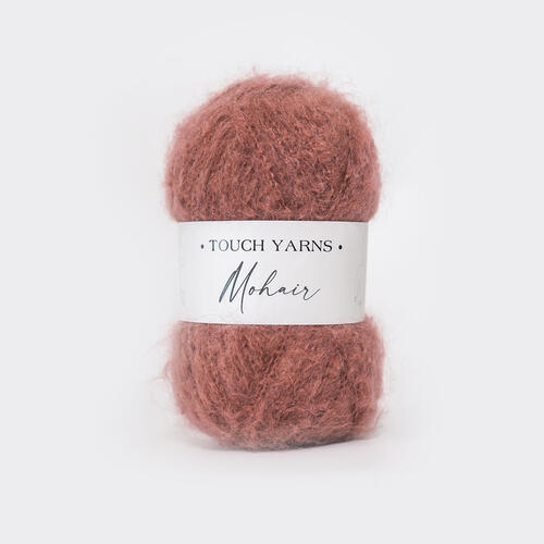 Ball of pink yarn with a 'Touch Yarns' label on a white background