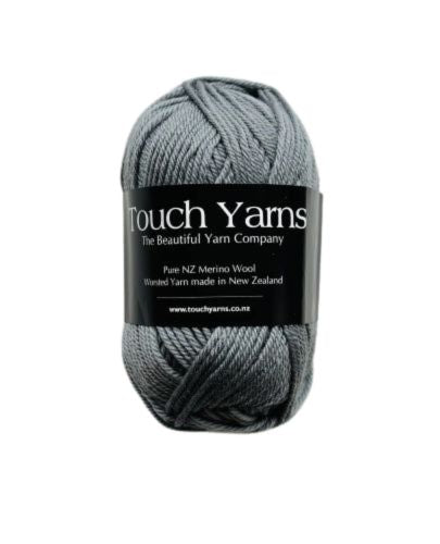 A skein of Touch Yarns Pure Merino 8ply yarn in shade schist, with the brand label visible.