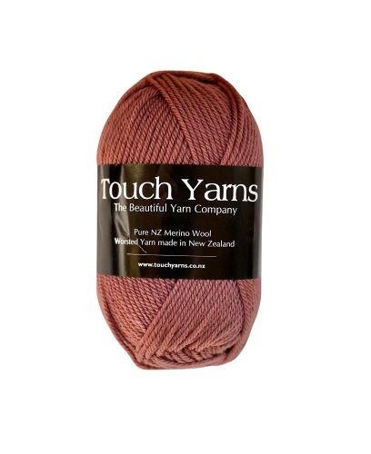 A skein of Touch Yarns Pure Merino 8Ply in the colour Vintage Rose, with the brand label visible.