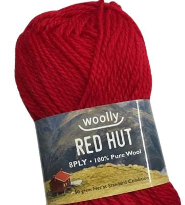 A skein of red wool yarn with a label showing the brand 'Woolly' and the product name 'RED HUT 8PLY 100% Pure Wool'.