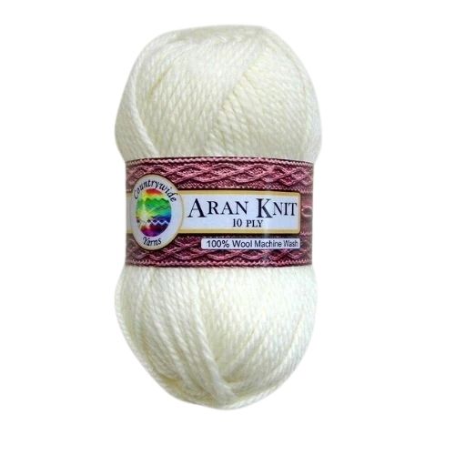 A skein of Countrywide Aran Knit 10 Ply wool yarn in white color with a label showing the brand and product details.