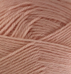 A close up of Crucci Soft Pure Wool 4 Ply yarn in shade blush
