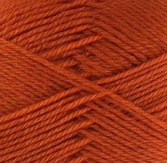 A close up of orange Crucci Soft Pure Wool 4 Ply yarn