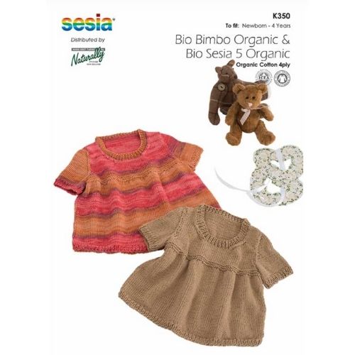 Knitted baby dresses on a white background.