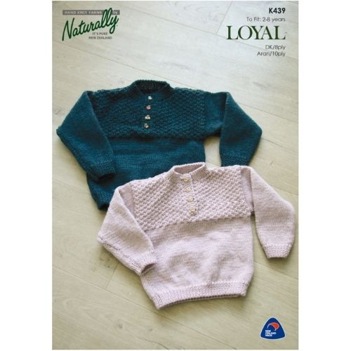Two knitted sweaters for children, one in green and the other in pink, laid flat on a wooden surface, with the Naturally brand logo and product information visible.