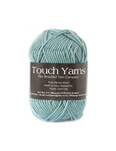 A skein of Touch Yarns Pure Merino 8 Ply wool yarn in the shade duck egg, with brand label visible.