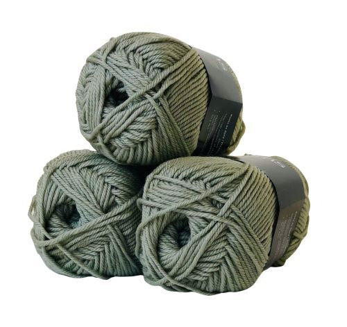 A skein of Touch Yarns Pure Merino 8 Ply wool yarn in a sage color, with brand label visible.